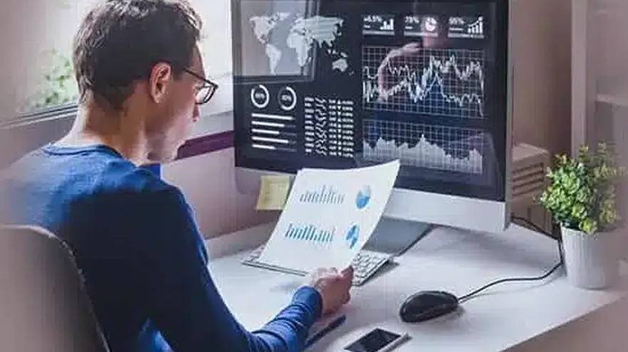Business analyst working with charts